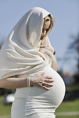 Image showing happy young pregnant woman outdoor