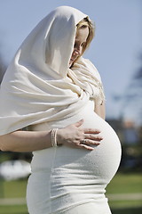 Image showing happy young pregnant woman outdoor