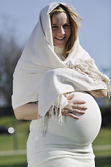 Image showing happy young pregnant woman outdoor