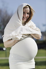 Image showing happy young pregnant woman outdoor