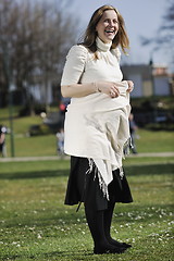 Image showing happy young pregnant woman outdoor