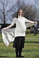 Image showing happy young pregnant woman outdoor