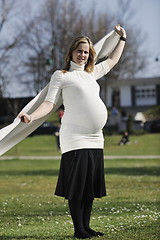 Image showing happy young pregnant woman outdoor