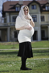 Image showing happy young pregnant woman outdoor