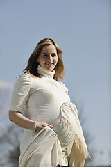 Image showing happy young pregnant woman outdoor