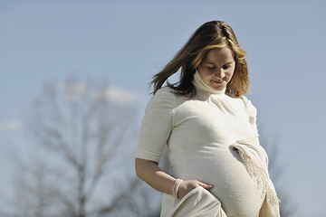 Image showing happy young pregnant woman outdoor