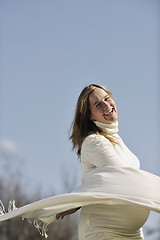 Image showing happy young pregnant woman outdoor