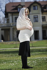 Image showing happy young pregnant woman outdoor