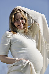 Image showing happy young pregnant woman outdoor