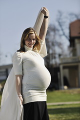 Image showing happy young pregnant woman outdoor