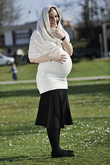 Image showing happy young pregnant woman outdoor