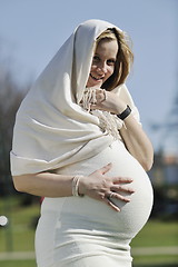 Image showing happy young pregnant woman outdoor