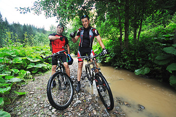 Image showing friendship and travel on mountain bike