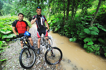 Image showing friendship and travel on mountain bike