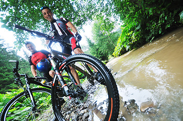 Image showing friendship and travel on mountain bike