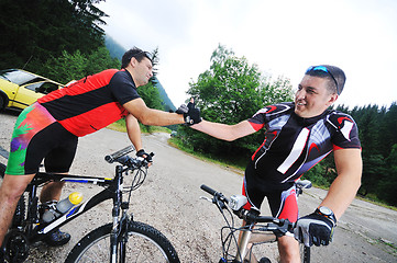 Image showing friendship and travel on mountain bike