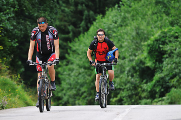 Image showing friendship and travel on mountain bike