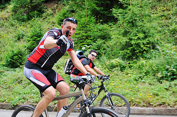 Image showing friendshiop outdoor on mountain bike