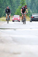 Image showing friendshiop outdoor on mountain bike