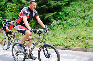 Image showing friendshiop outdoor on mountain bike