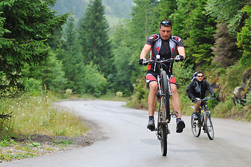 Image showing friendshiop outdoor on mountain bike