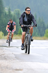 Image showing friendshiop outdoor on mountain bike