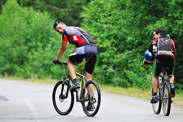 Image showing friendship and travel on mountain bike