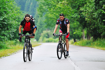 Image showing friendship and travel on mountain bike