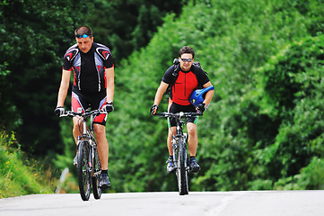 Image showing friendship and travel on mountain bike