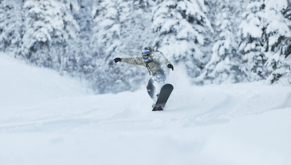 Image showing freestyle snowboarder jump and ride