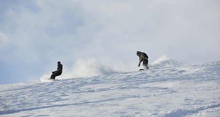 Image showing freestyle snowboarder jump and ride