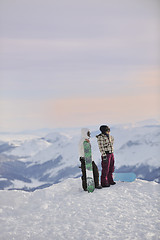 Image showing snowboarder's couple on mountain's top