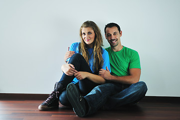 Image showing happy couple in empty apartment