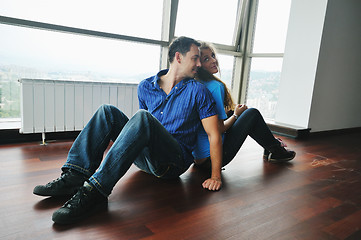 Image showing happy couple in empty apartment