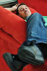 Image showing man relaxing on sofa 