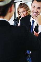 Image showing happy young couple buying new home with real estate agent