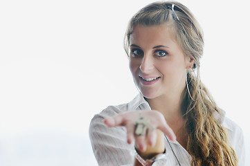 Image showing young woman throwing home keys in air