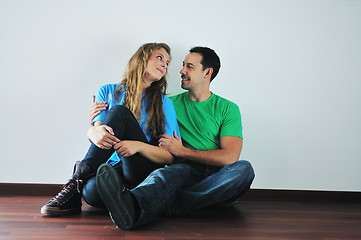 Image showing happy couple in empty apartment