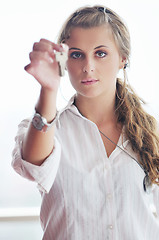 Image showing young woman throwing home keys in air