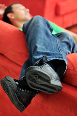 Image showing man relaxing on sofa