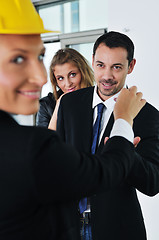 Image showing happy young couple buying new home with real estate agent