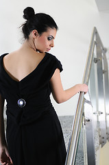 Image showing lady on black dress look back