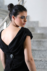 Image showing lady on black dress look back