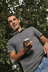 Image showing young casual man talking on cellphone