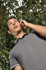 Image showing young casual man talking on cellphone