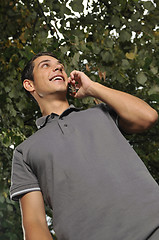 Image showing young casual man talking on cellphone