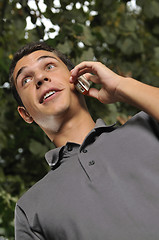 Image showing young casual man talking on cellphone