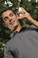 Image showing young casual man talking on cellphone