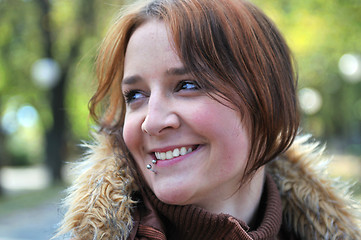 Image showing brunette Cute young woman smiling outdoors