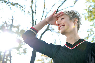 Image showing blonde Cute young woman looking out 